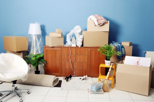 Boxes and small furniture prepared for a student move